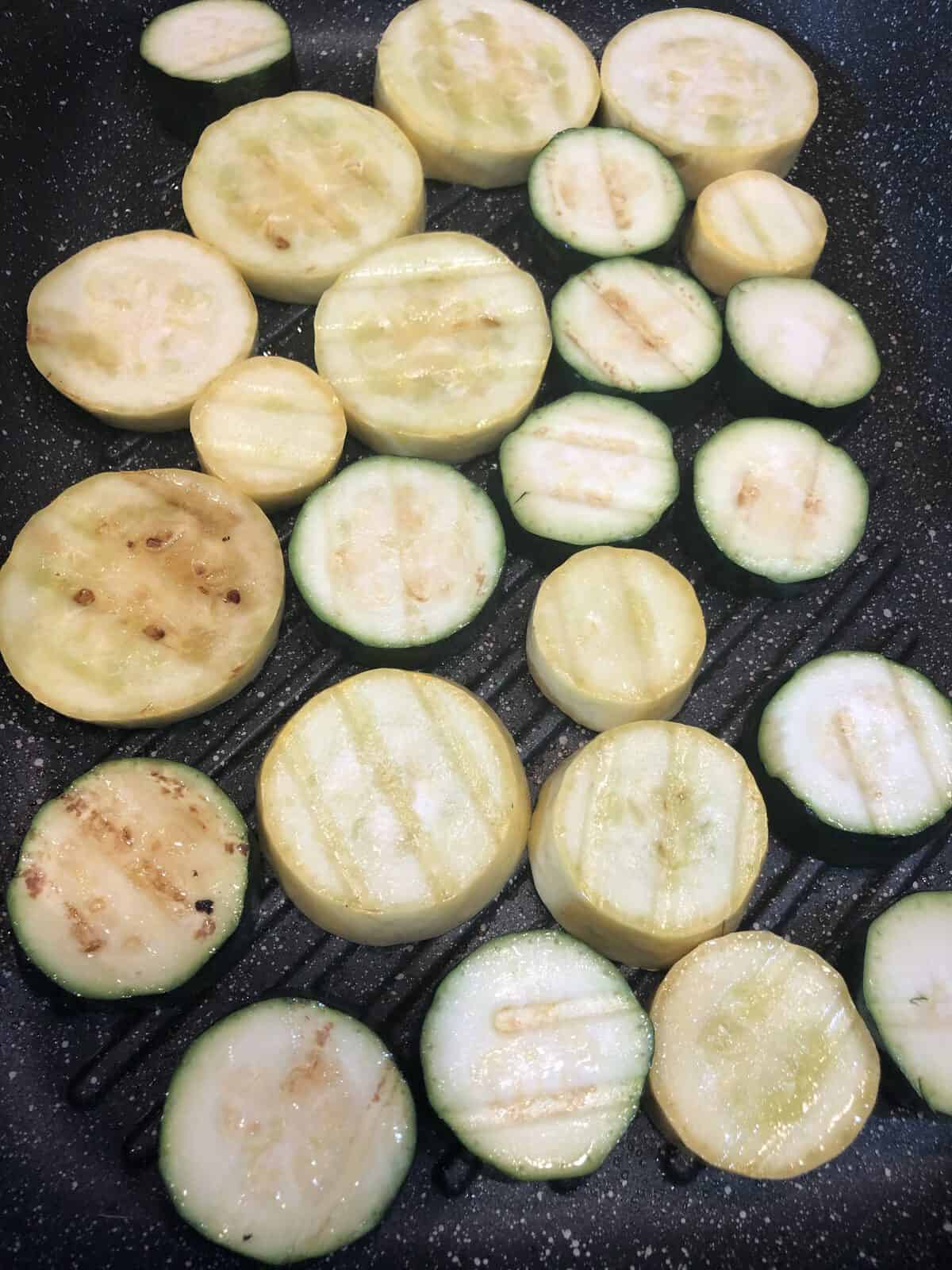 Grilling zucchini  and squash slices on an indoor grill