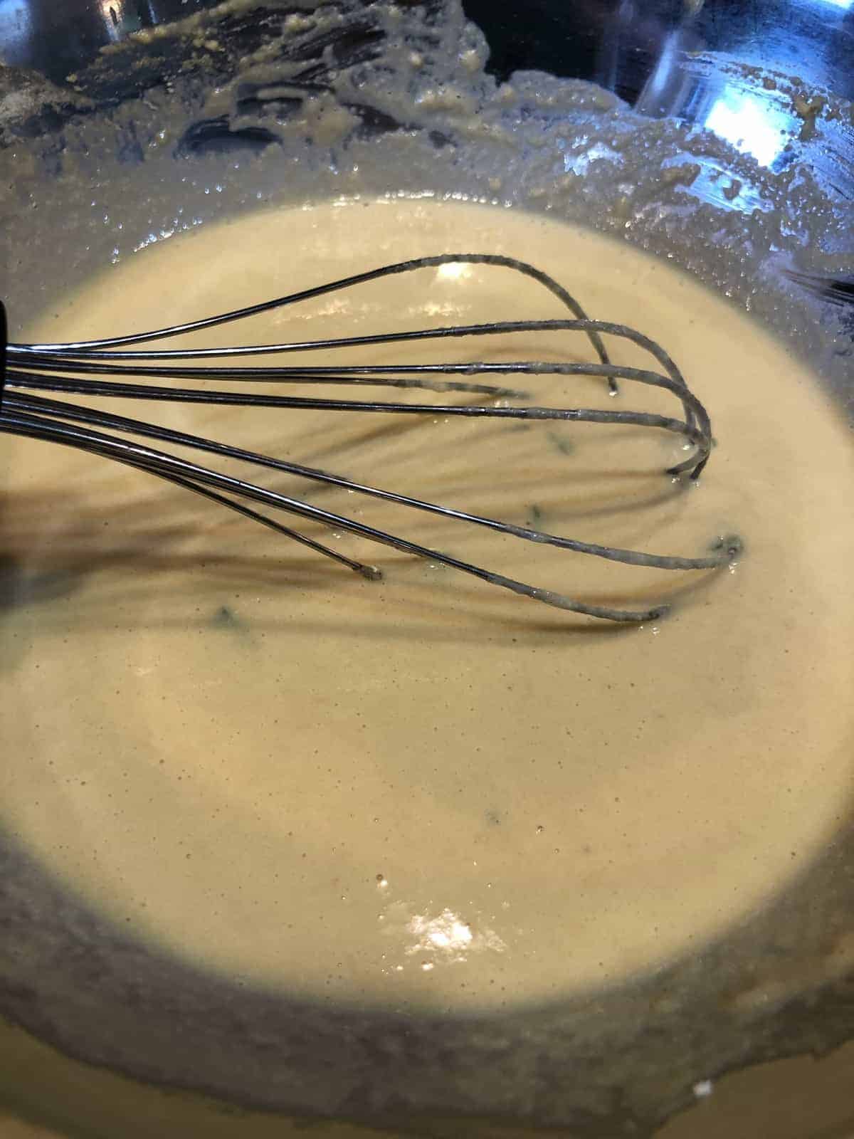 Chickpea Crepe Batter being whisked in a bowl
