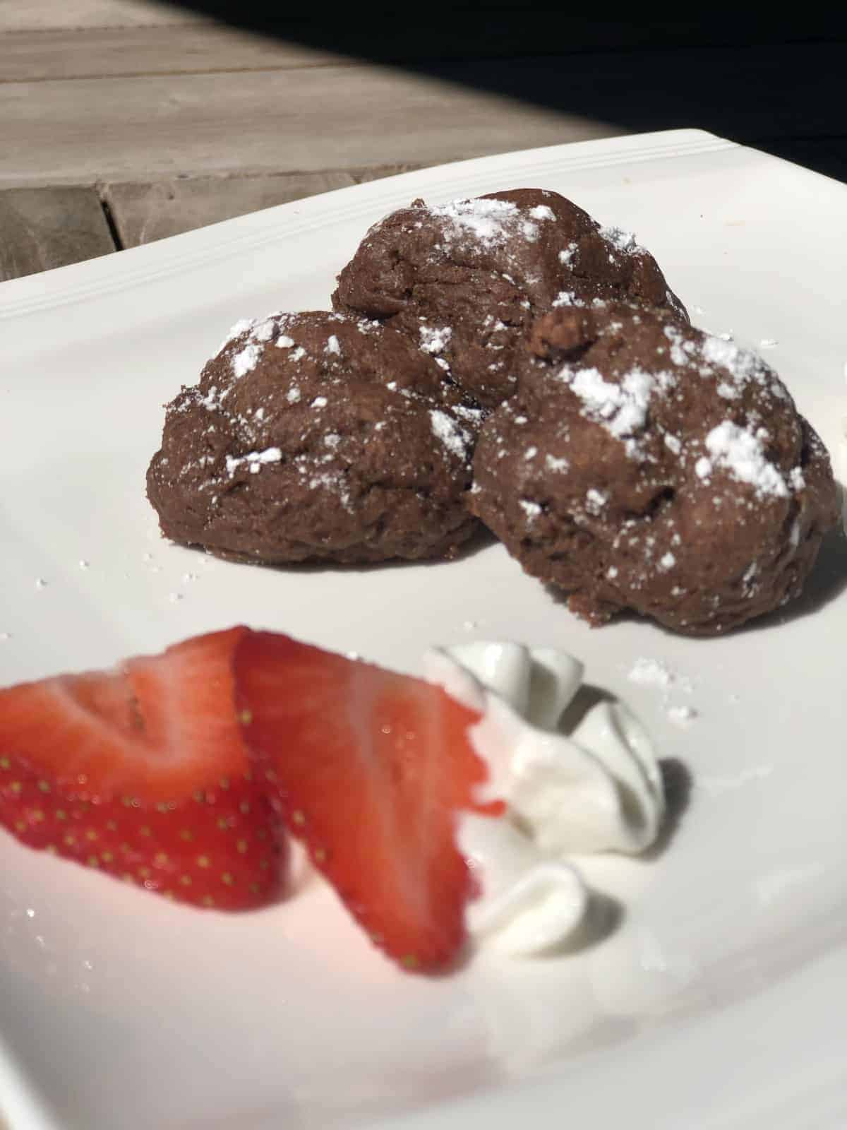 strawberries and low fat chocolate cookies on a white plate