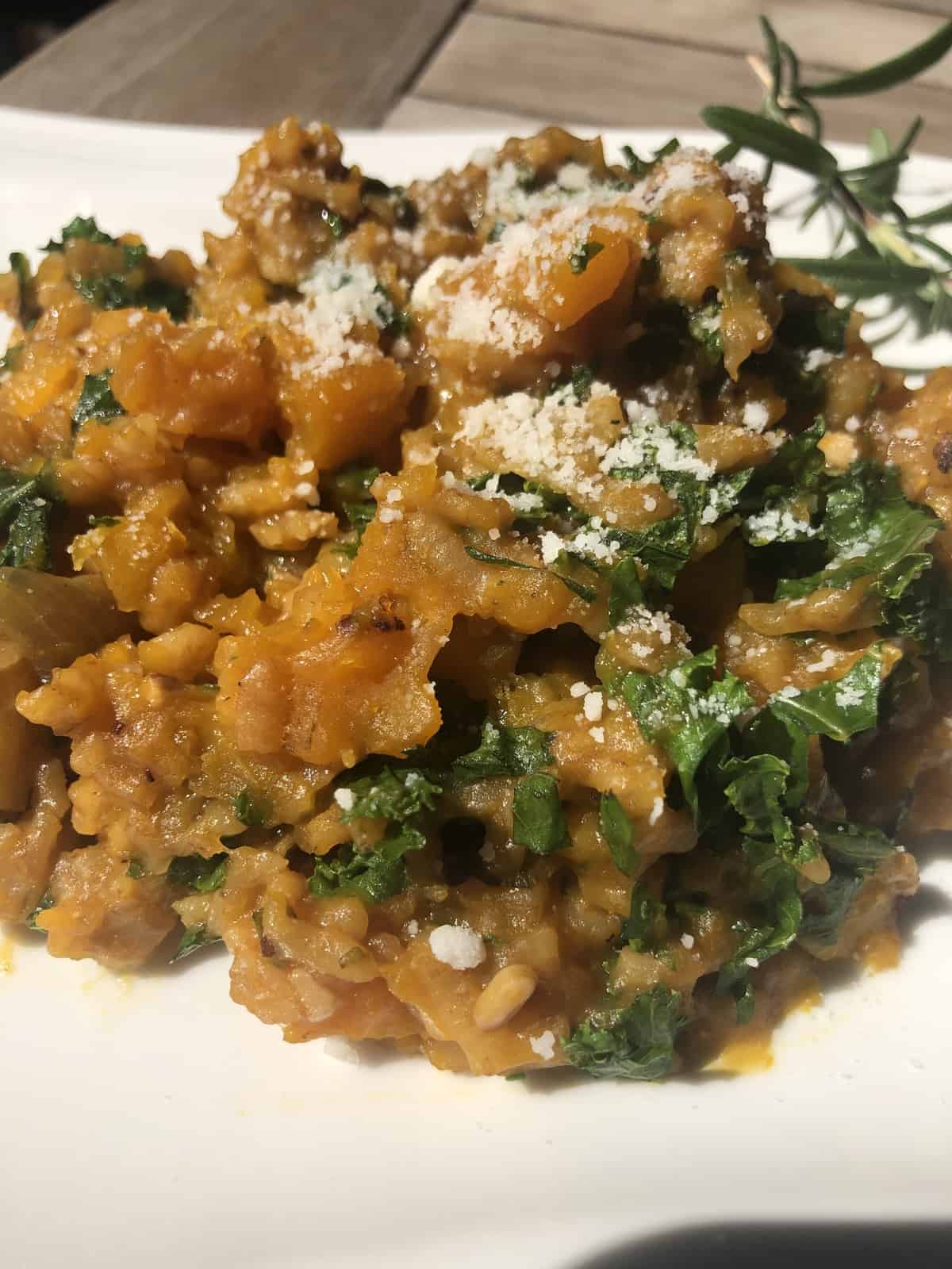 Butternut Squash Risotto with Kale on a white plate