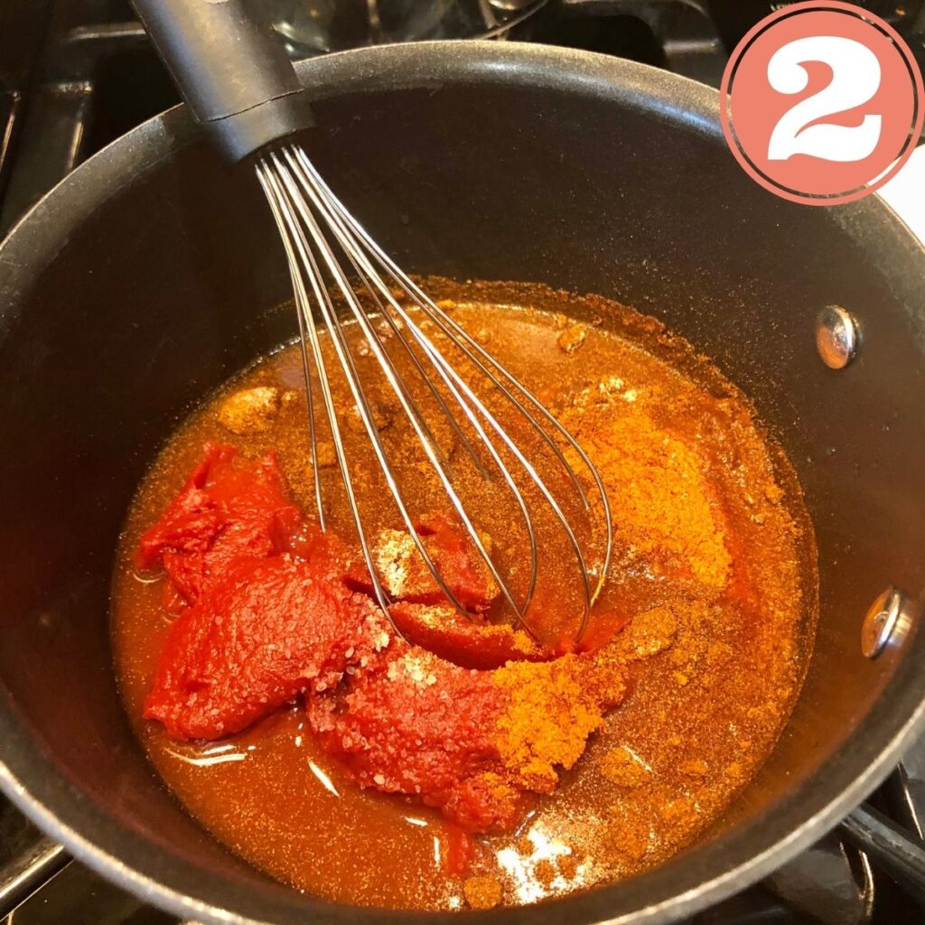 whisking BBQ sauce in a pot