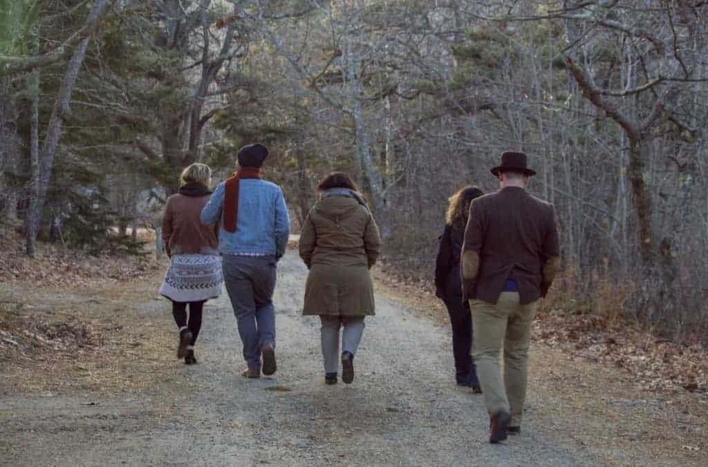a family walking in the woods