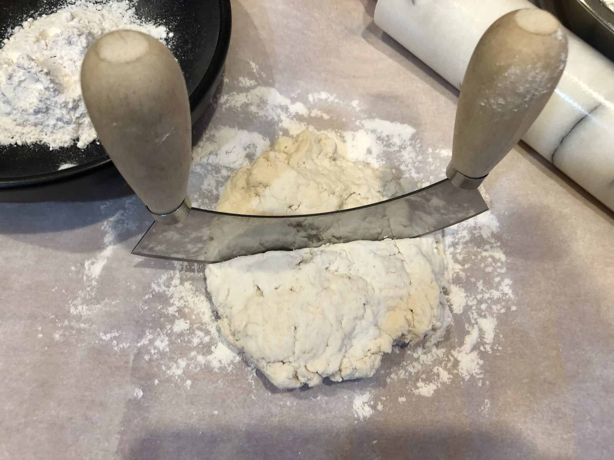 cutting the pizza dough