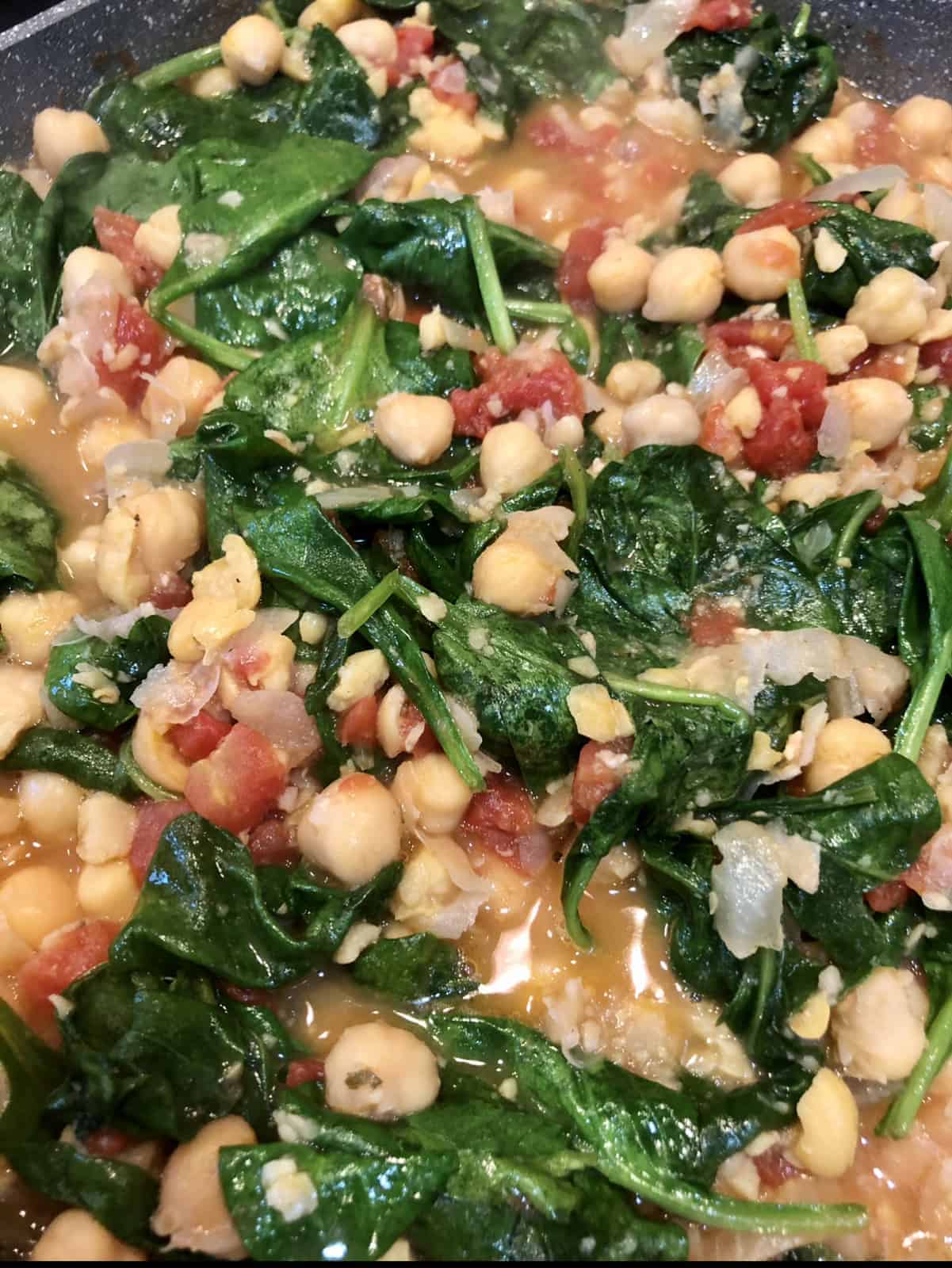 Vegan Chickpea Stew contains spinach, tomatoes and chickpeas