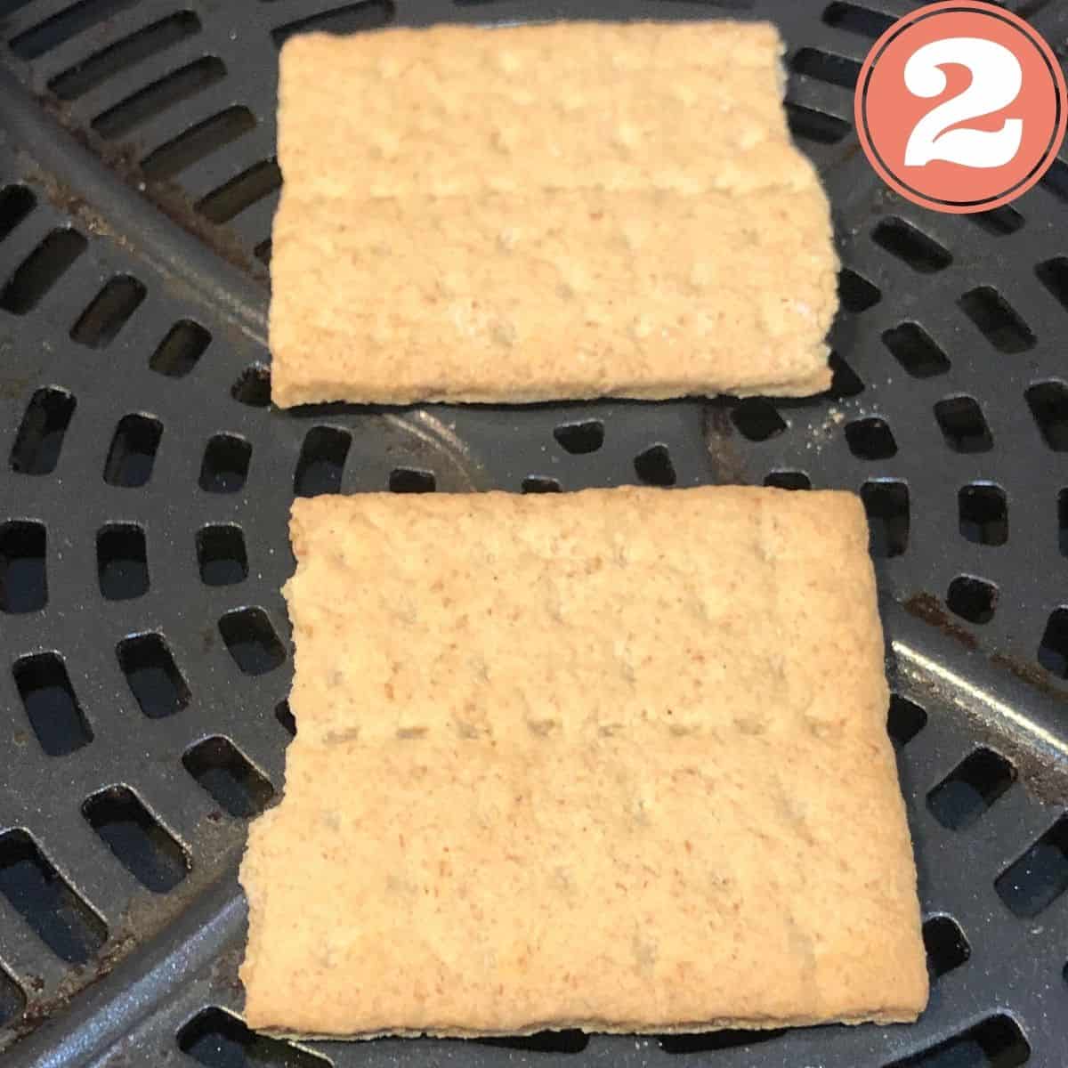 Two Graham crackers in an air fryer basket