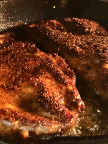Chicken cutlets in a cast iron skillet