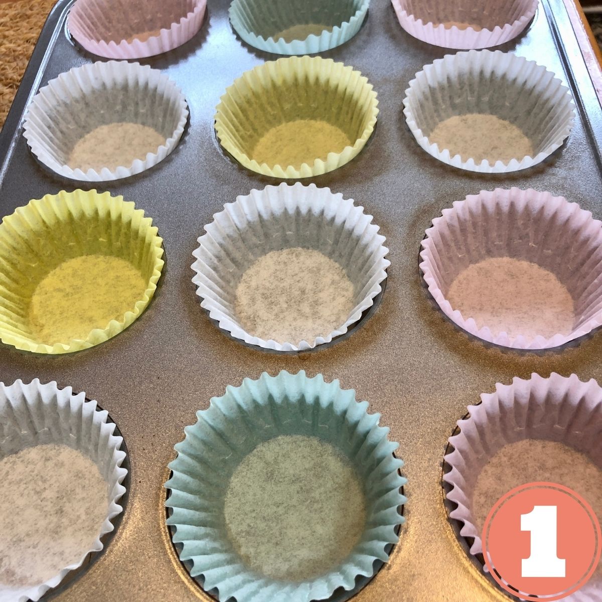 colored cupcake liners in a muffin tin