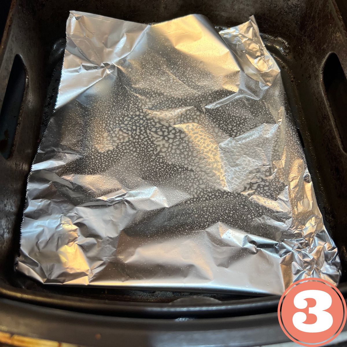 Aluminum foil in an air fryer basket