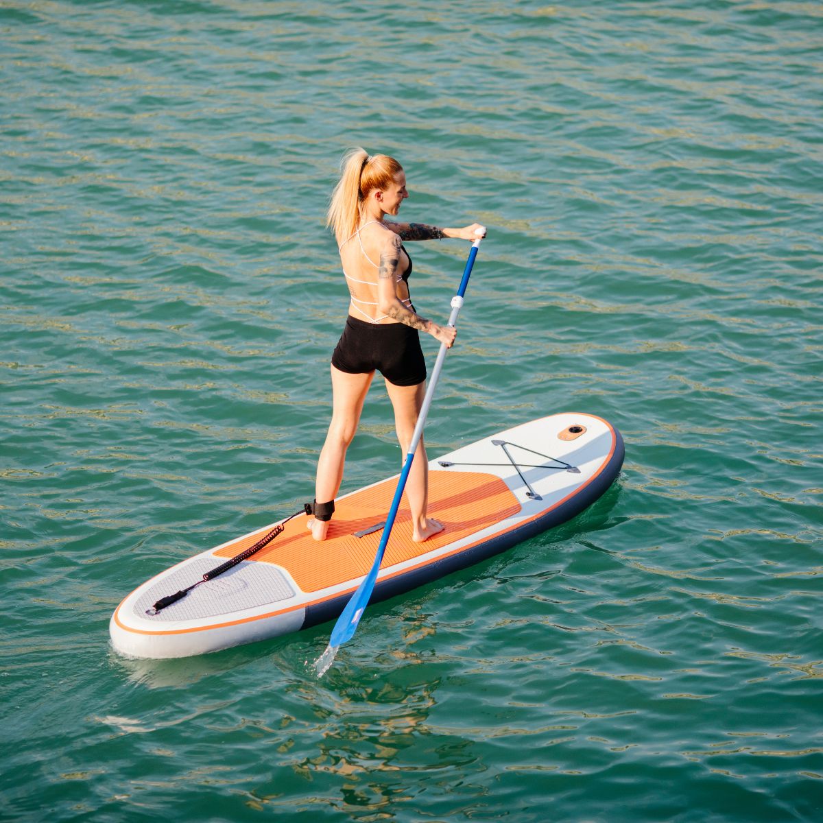 Female on a paddle board in the water