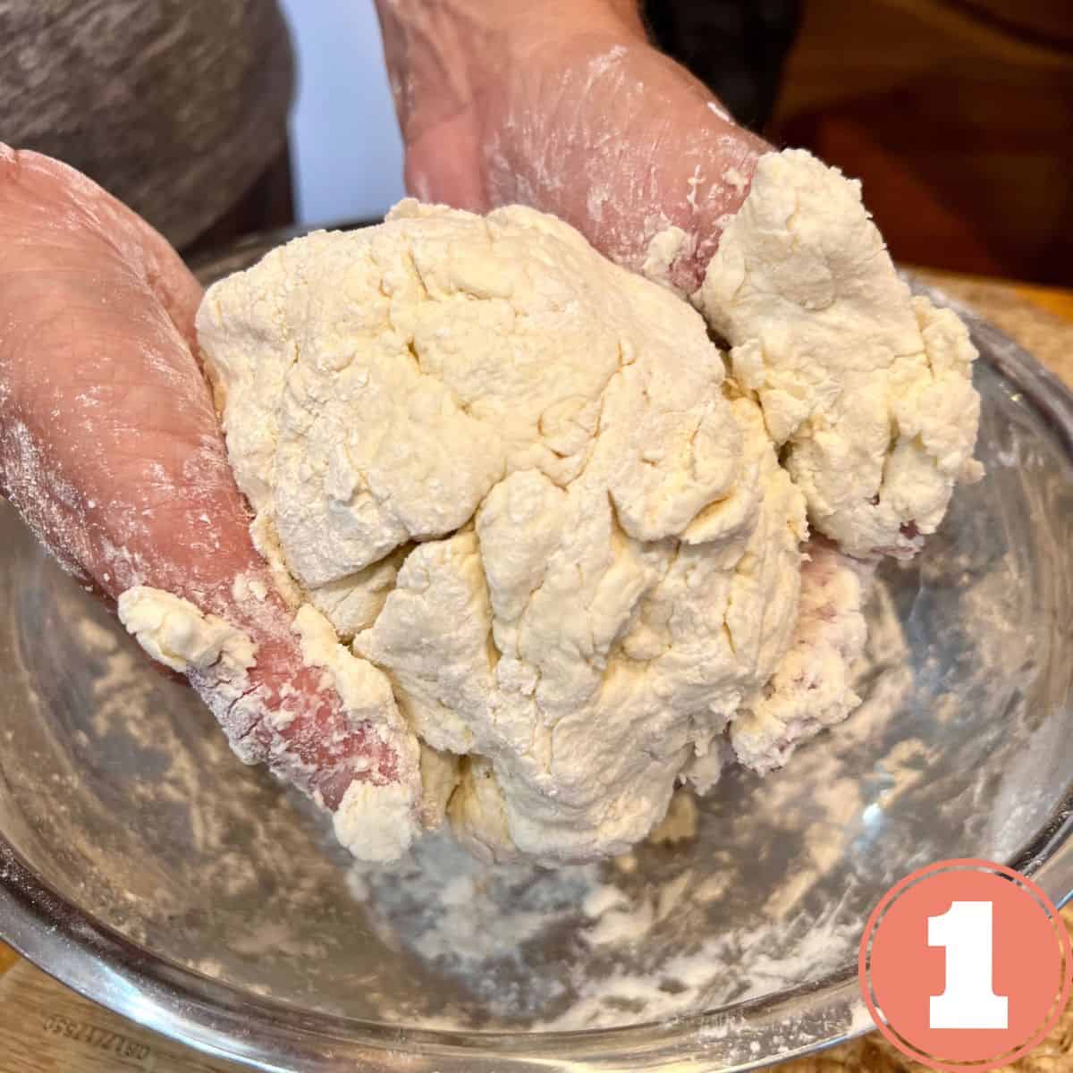 Hands holding a ball of dough