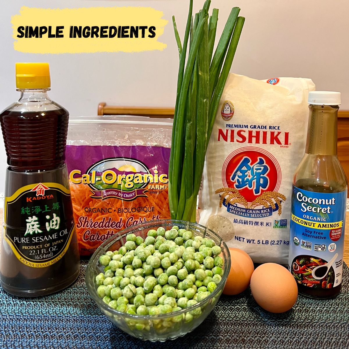 Ingredients for fried rice sesame oil carrots rice scallions peas and eggs and coconut aminos