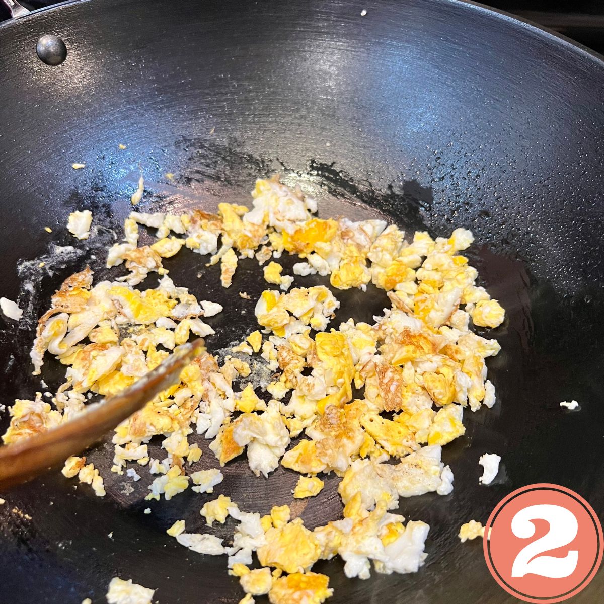 scrambled eggs in a wok
