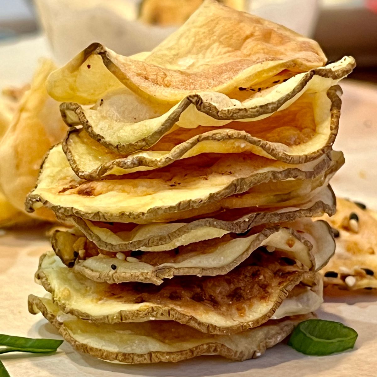 A stack of homemade oil free potato chips