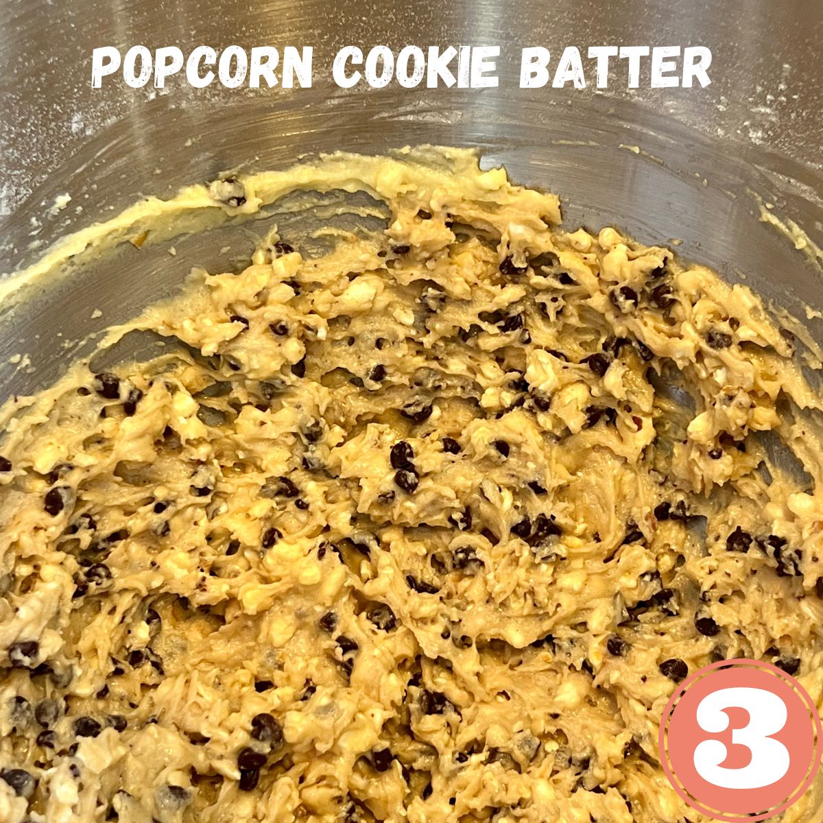 Chocolate chip popcorn cookie batter in a stainless steel bowl
