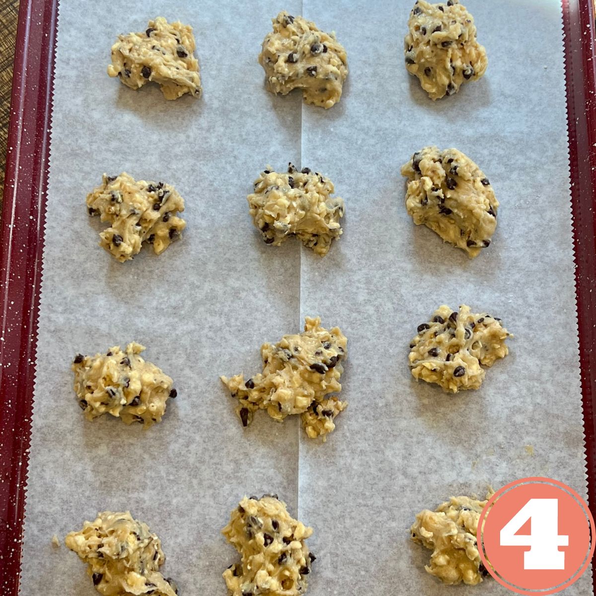 Weight Watchers Popcorn Chocolate chip cookie dough dollops on a baking pan lined with parchment paper