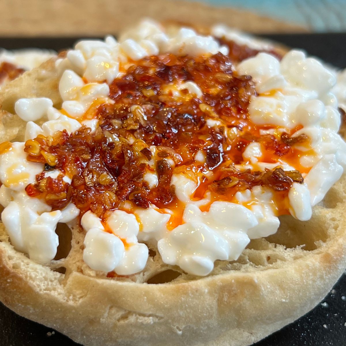 Chili Onion Crunch on an English Muffin with Cottage Cheese