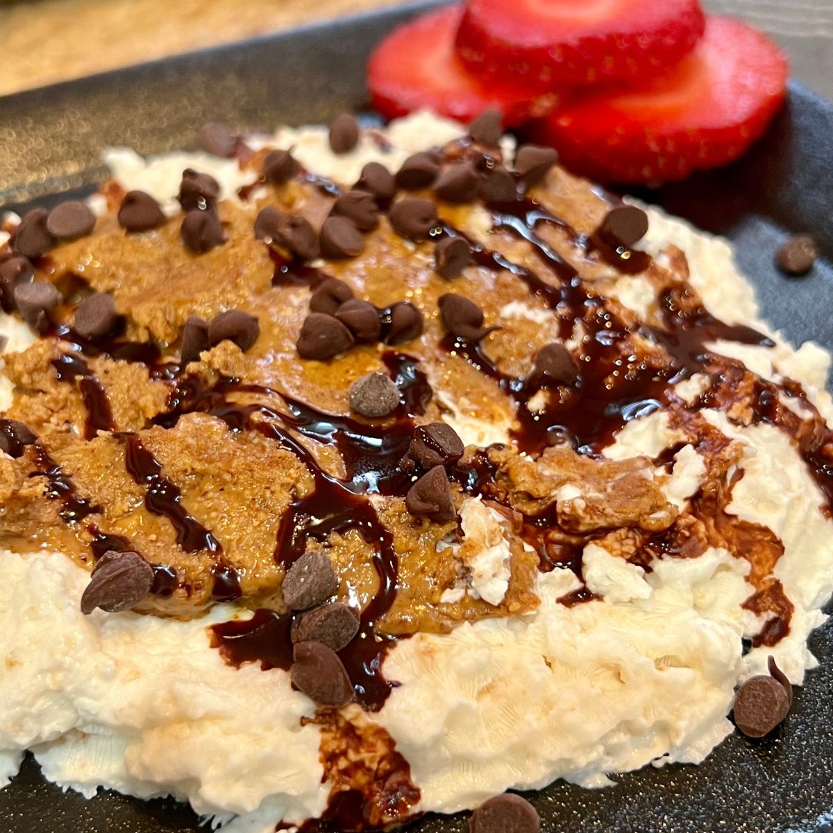 Chocolate Chip rice cake cookie on a plate with berries