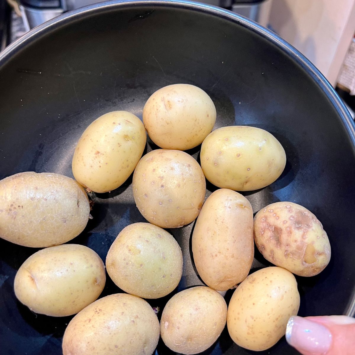 A bowl holding mini golden potatoes