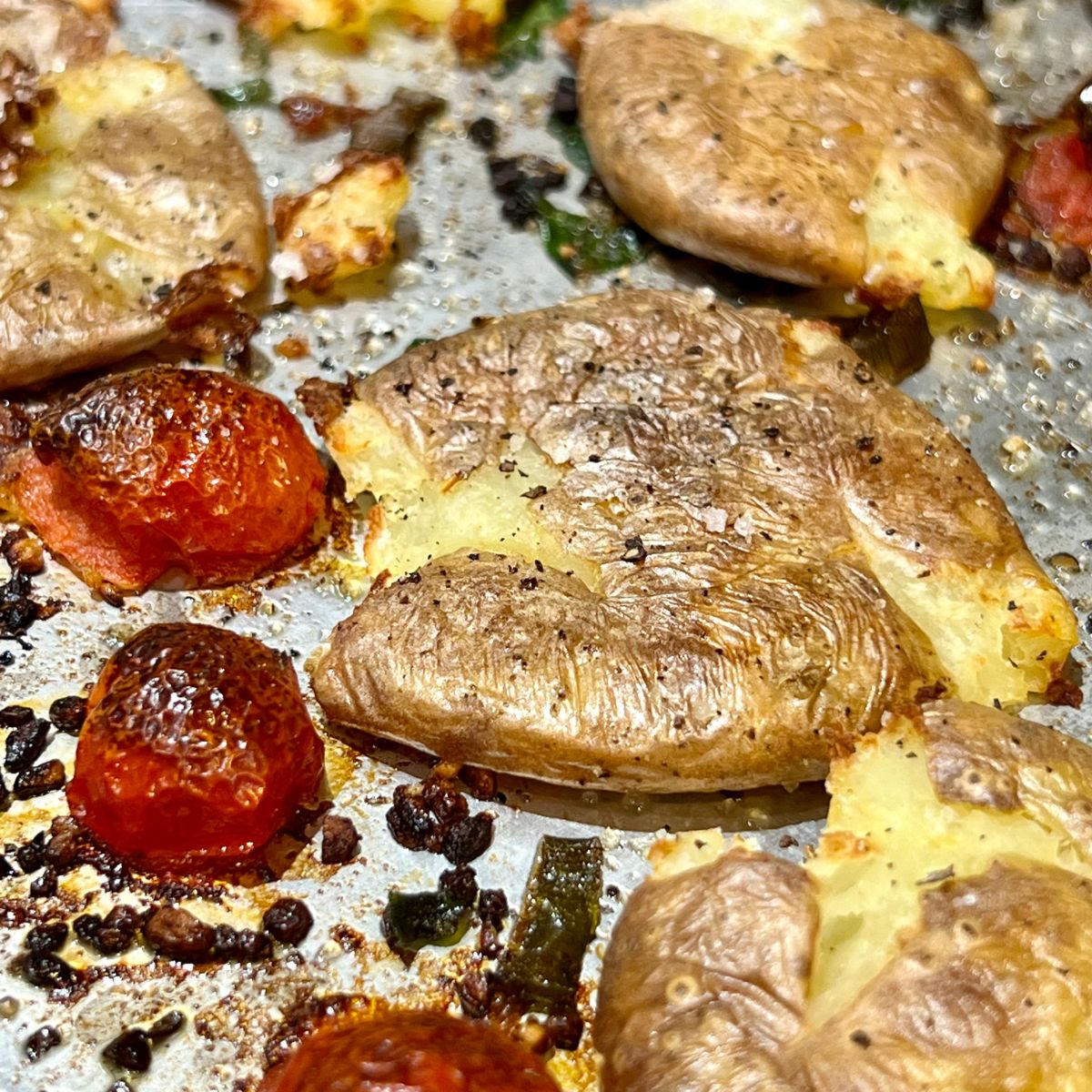 Garlic herb smashed potatoes on a sheet pan