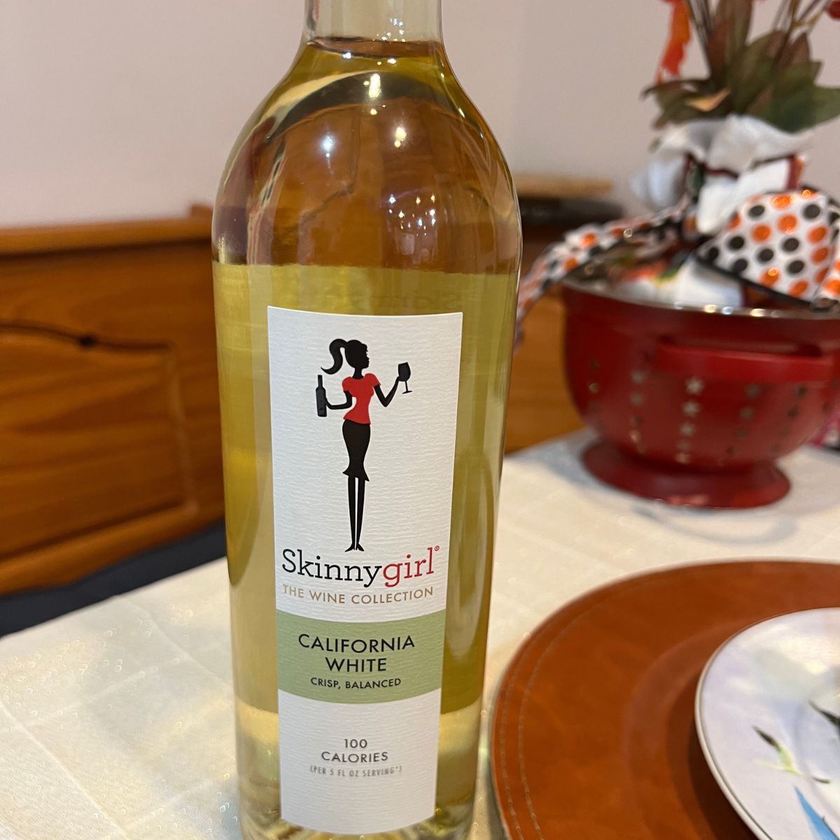 A bottle of Skinnygirl wine on a table
