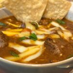 Slow cooker steak chili in a white bowl