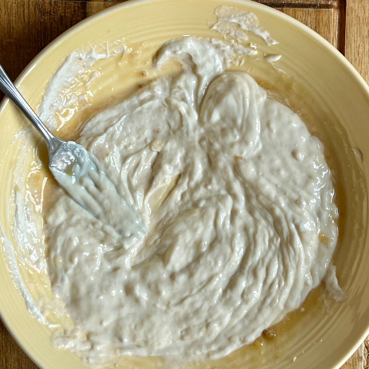 Creamy Banana protein pudding in a yellow bowl