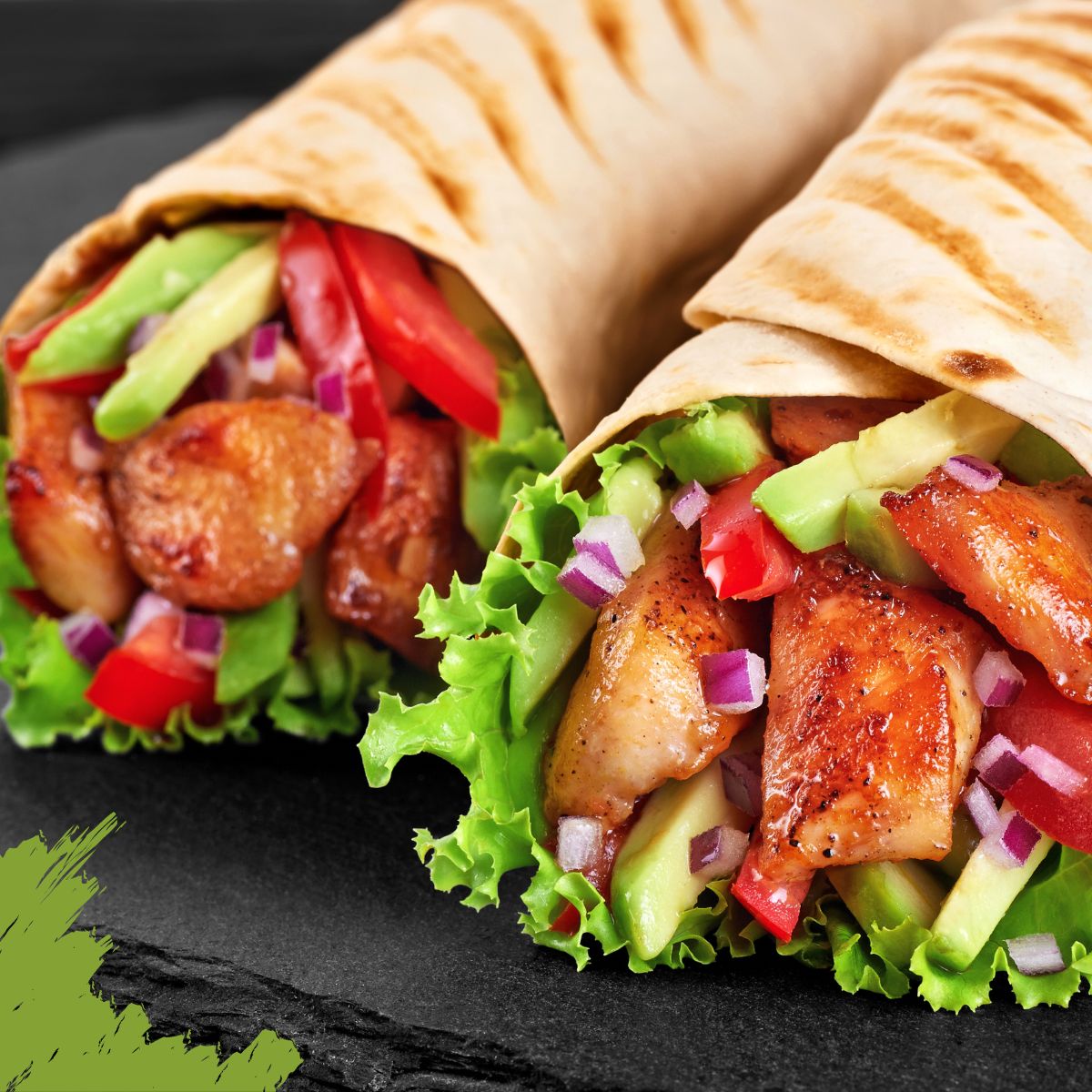 Two grilled chicken wraps with lettuce