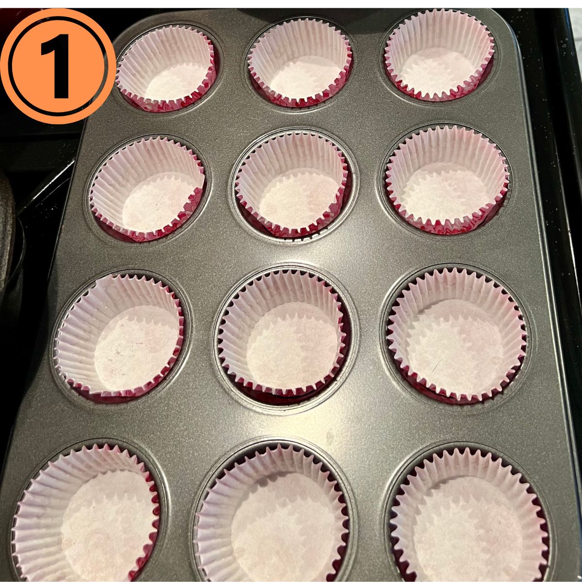 A muffin pan with paper liners