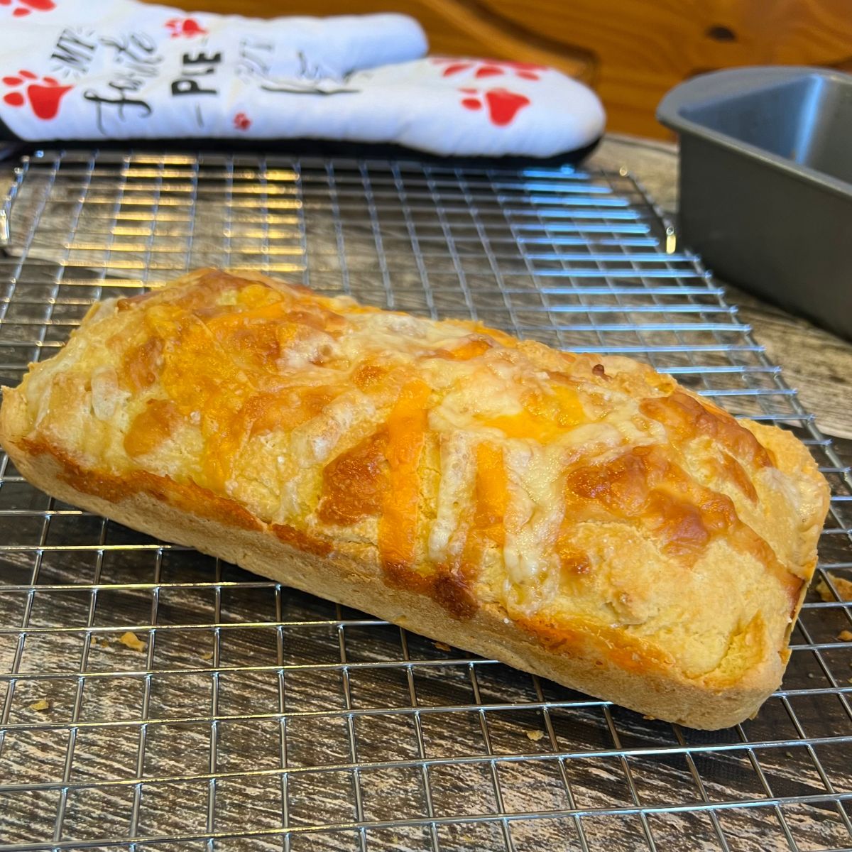 A loaf of 3 ingredient keto bread on a wire rack