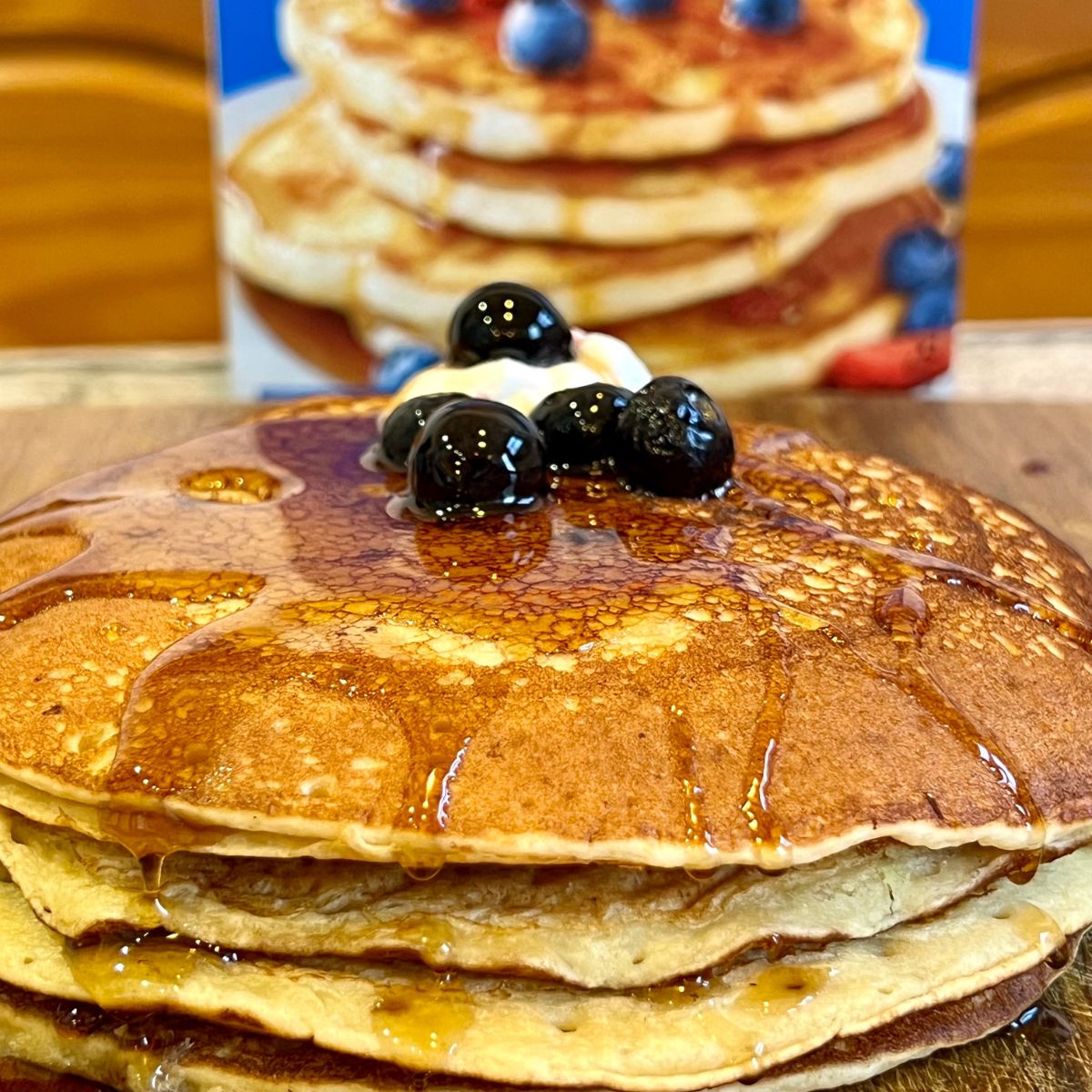 A stack of buttermilk pancakes with maple syrup