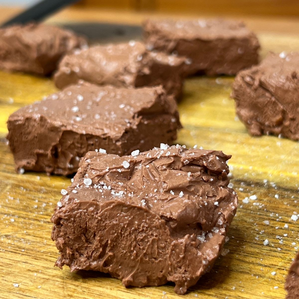 Weight Watchers chocolate fudge squares on a wooden cutting board