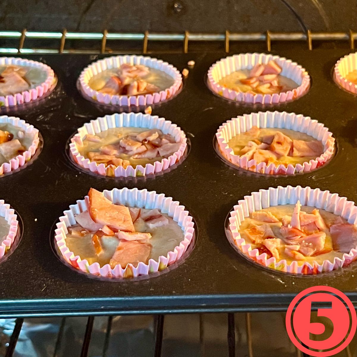 Canadian Bacon Pancake Muffins baking in an oven