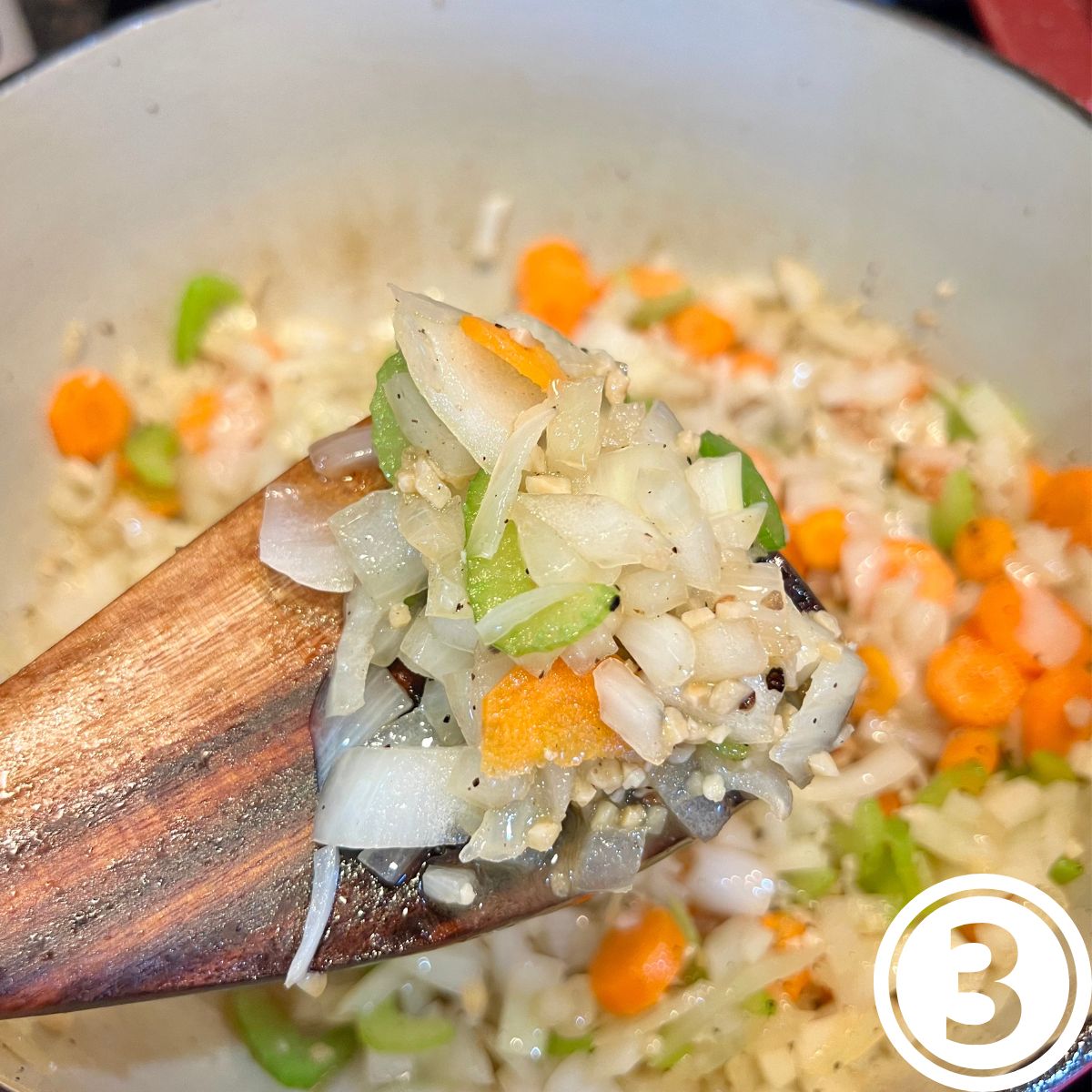 Sautéed onions, celery and carrots in a Dutch oven