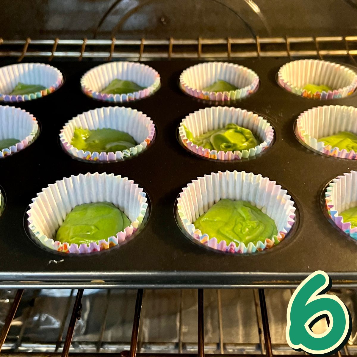 Spinach banana muffins baking in the oven in a muffin tin