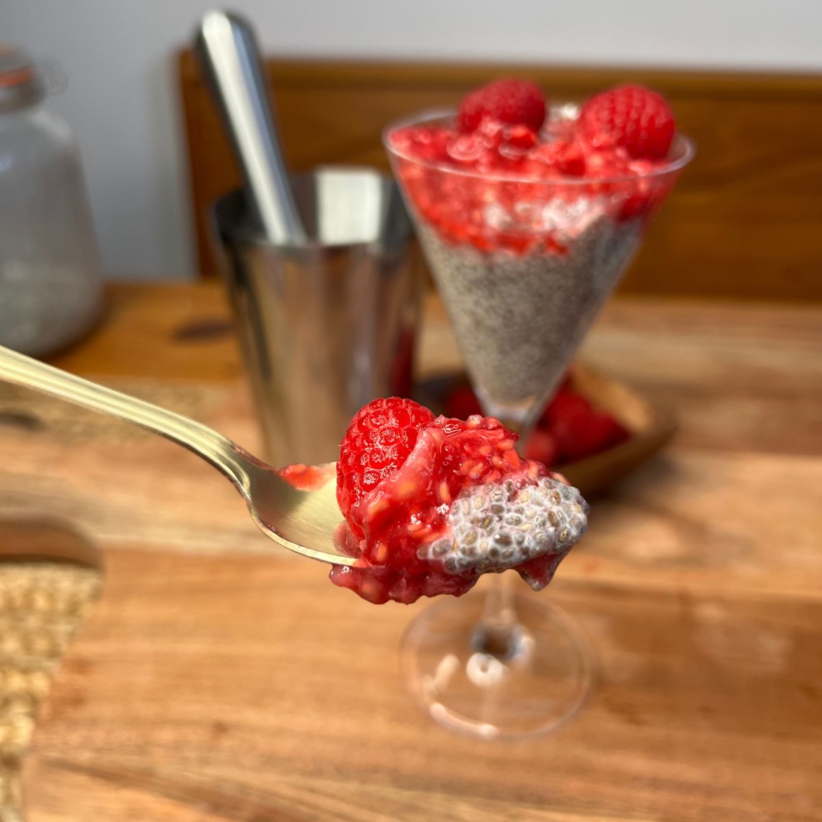 A spoon full of vanilla raspberry chia pudding