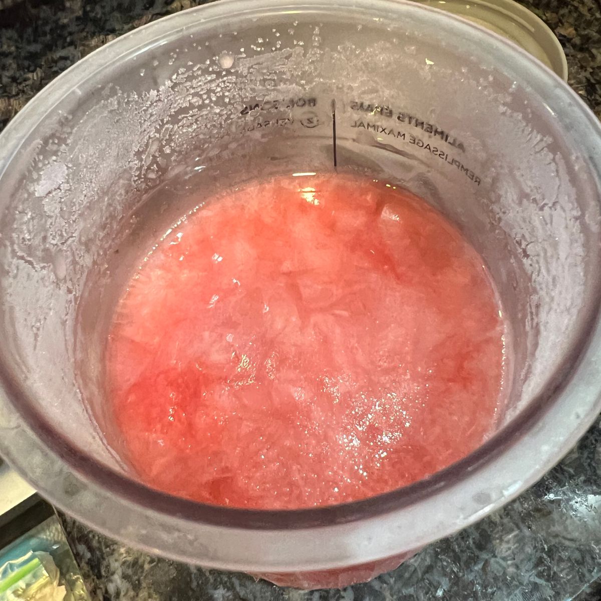 Pureed watermelon in a Ninja Creami Deluxe cup