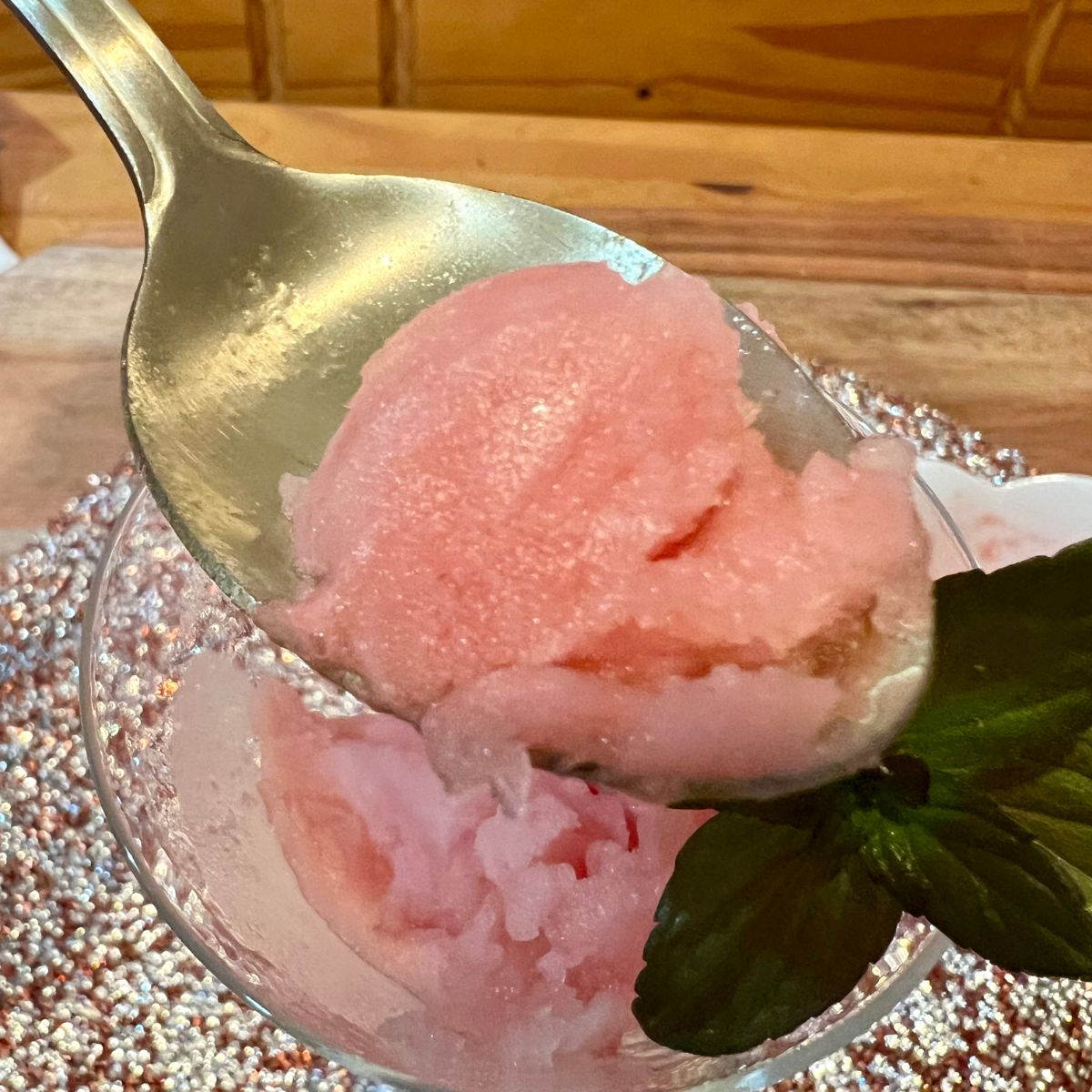 A spoon full of Ninja Creami Watermelon Italian Ice