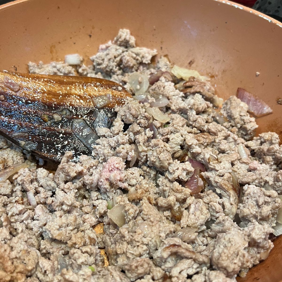 Browning turkey in a copper pot