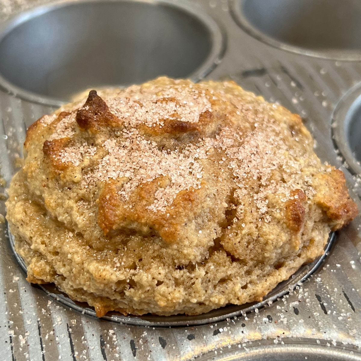 A Churro Muffin in a muffin pan