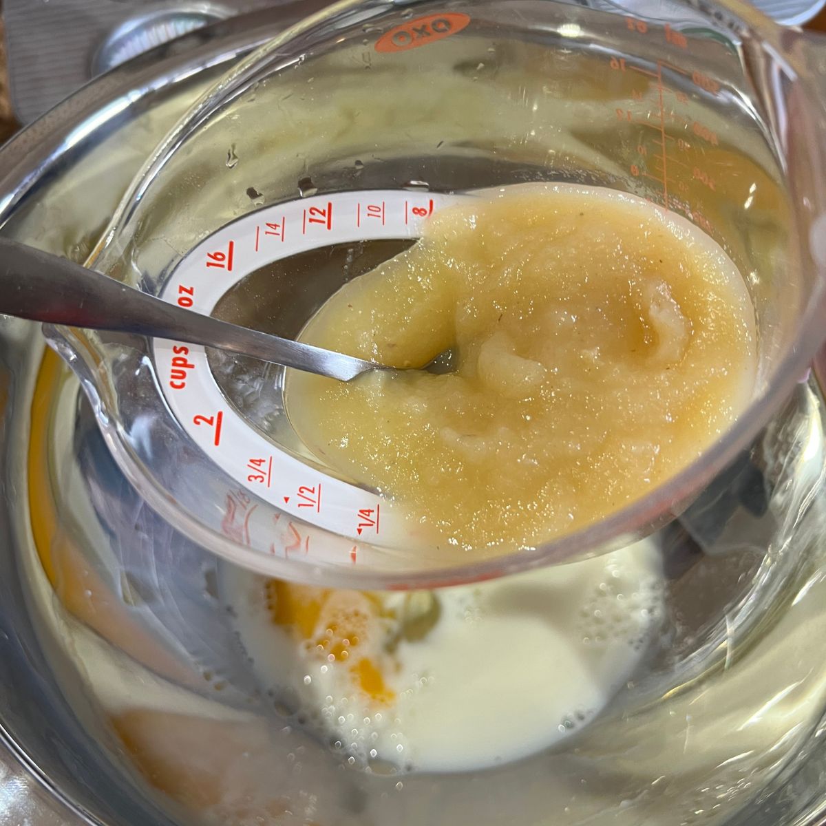 Applesauce in a measuring cup