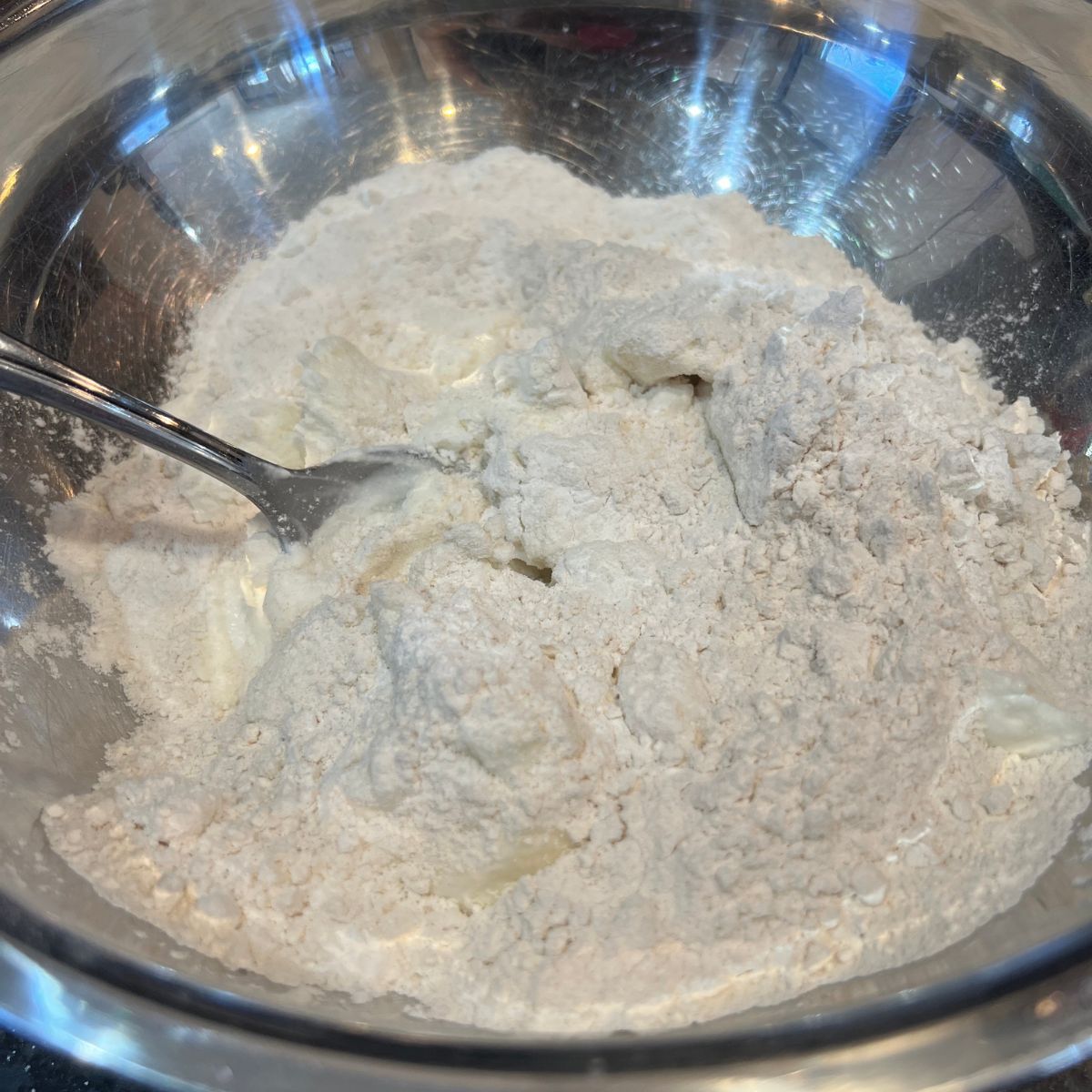 Cottage cheese bagel flour in a stainless steel bowl