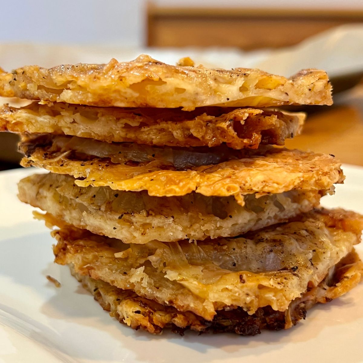 Keto Onions chips stacked on a plate