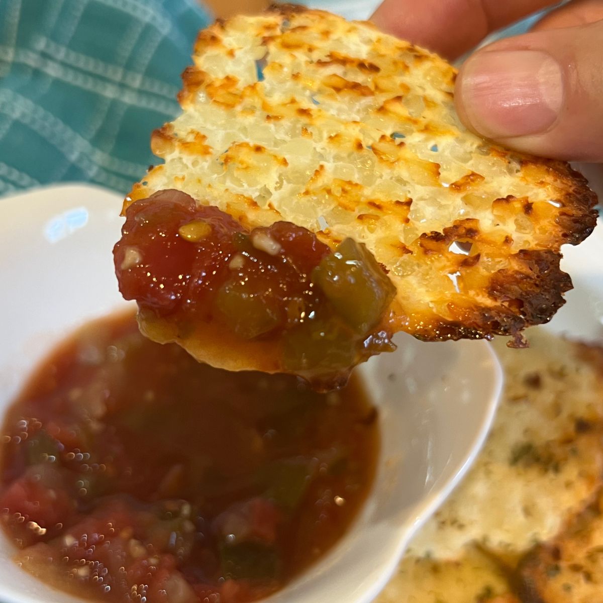 Cottage cheese chip dipped in salsa