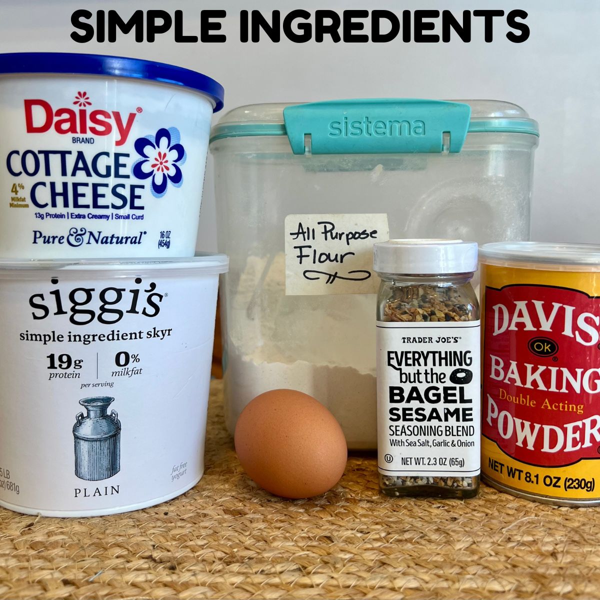 Greek Yogurt, Cottage Cheese, Flour Egg, Baking Powder and seasoning on a table