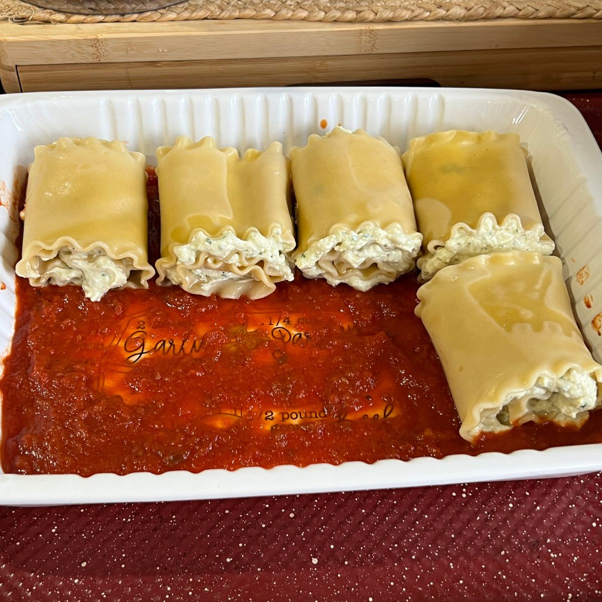 Lasagna roll-ups in a casserole dish