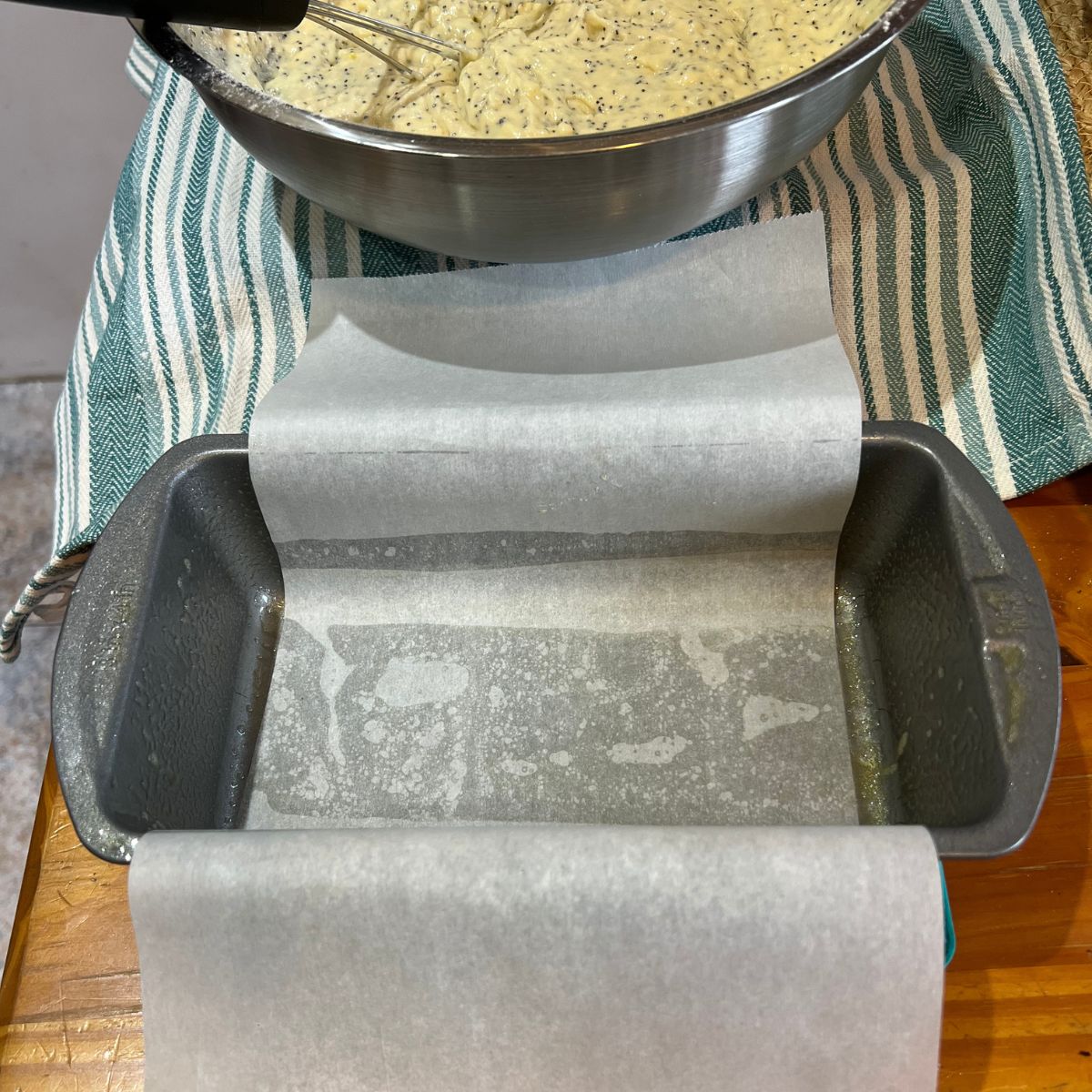 A 9x5 loaf pan lined with parchment paper