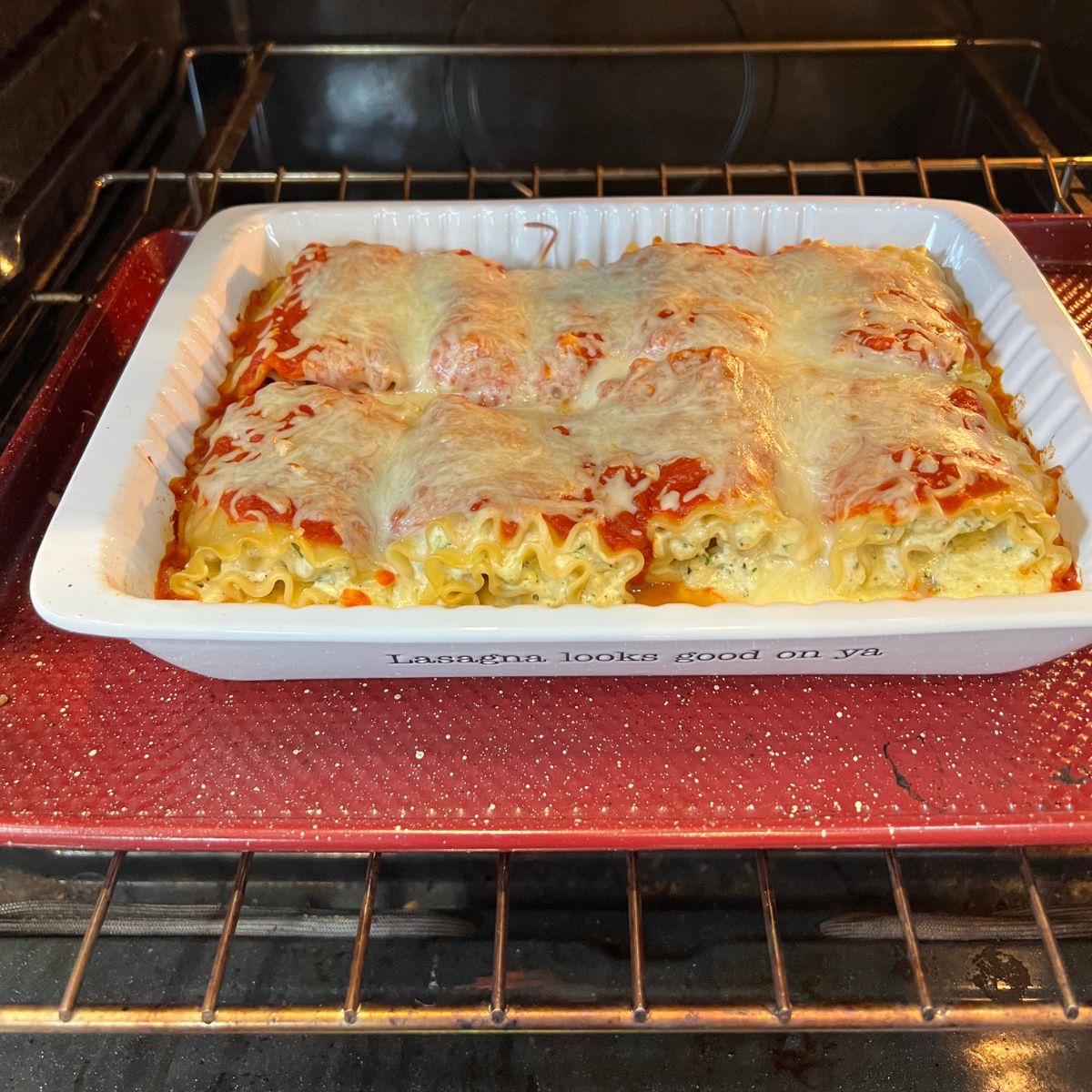 Golden cottage cheese lasagna rollups in the oven