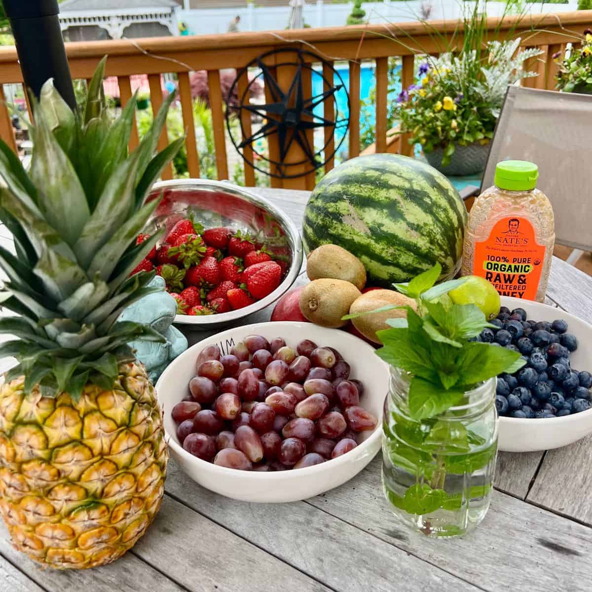 Honey fruit salad ingredients on a table