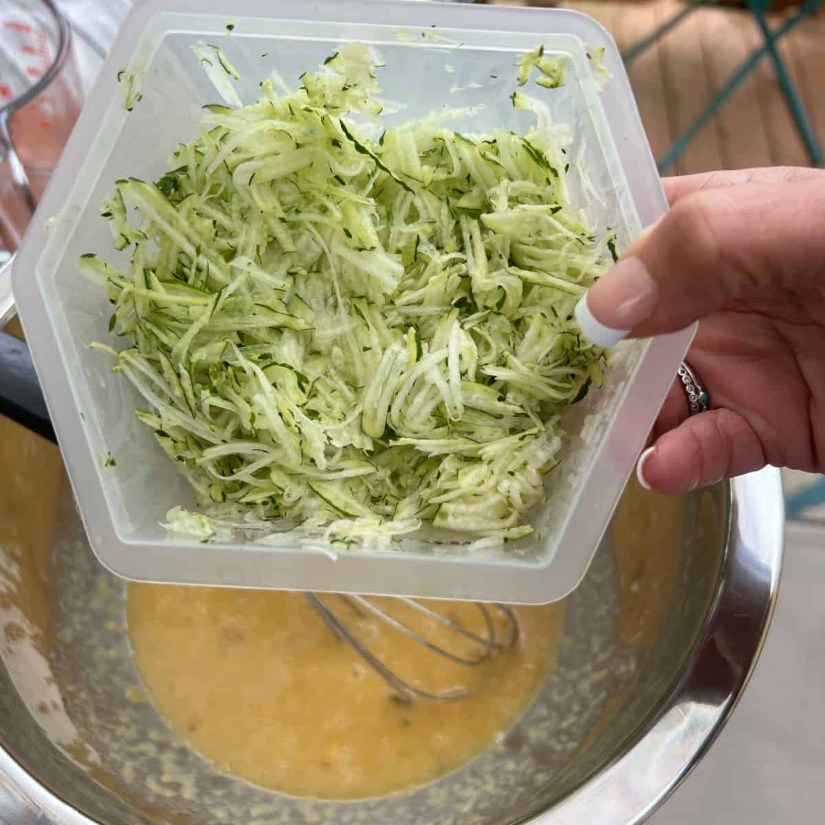 Shredded zucchini for healthy banana zucchini muffins