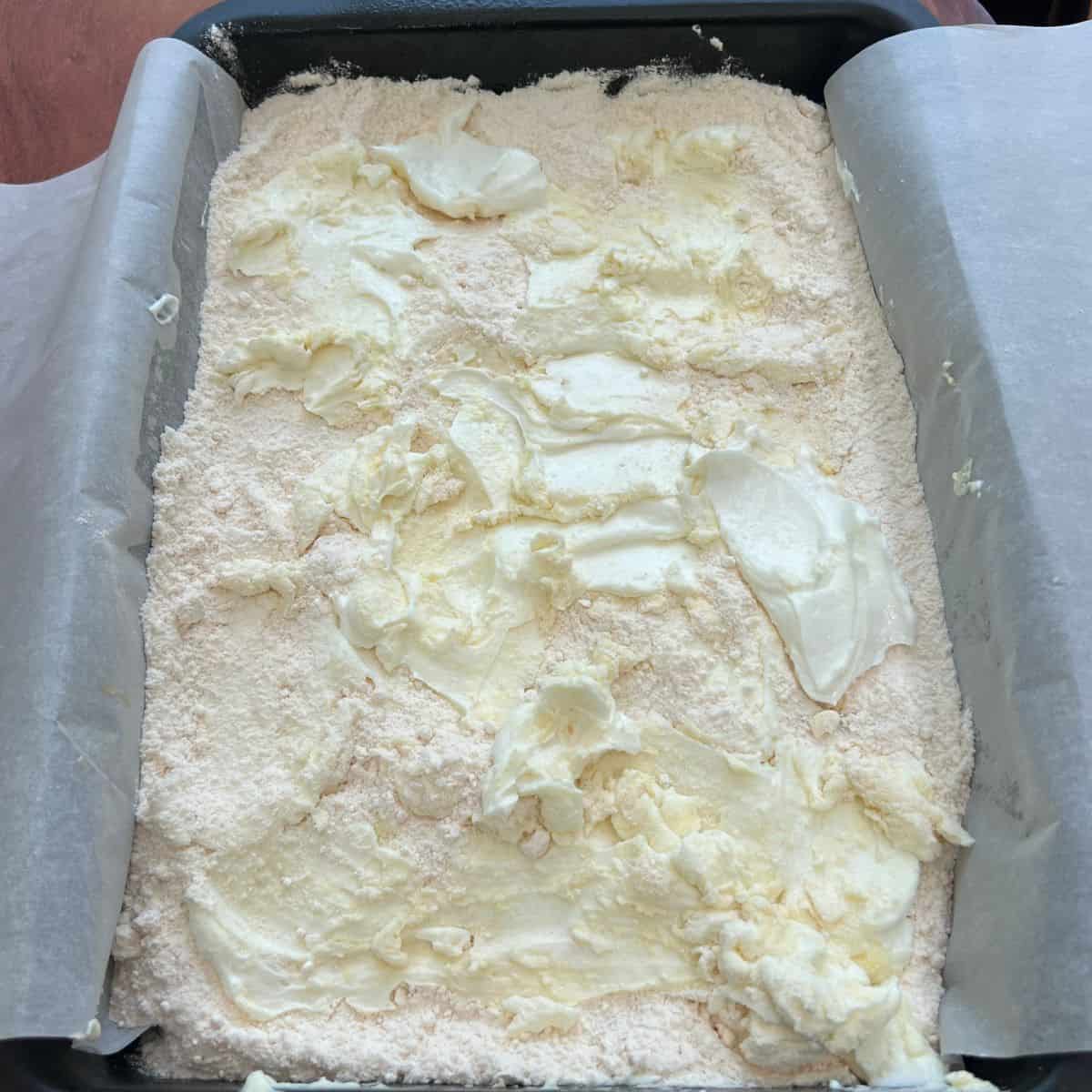 Lemon curd yogurt cake in a baking dish